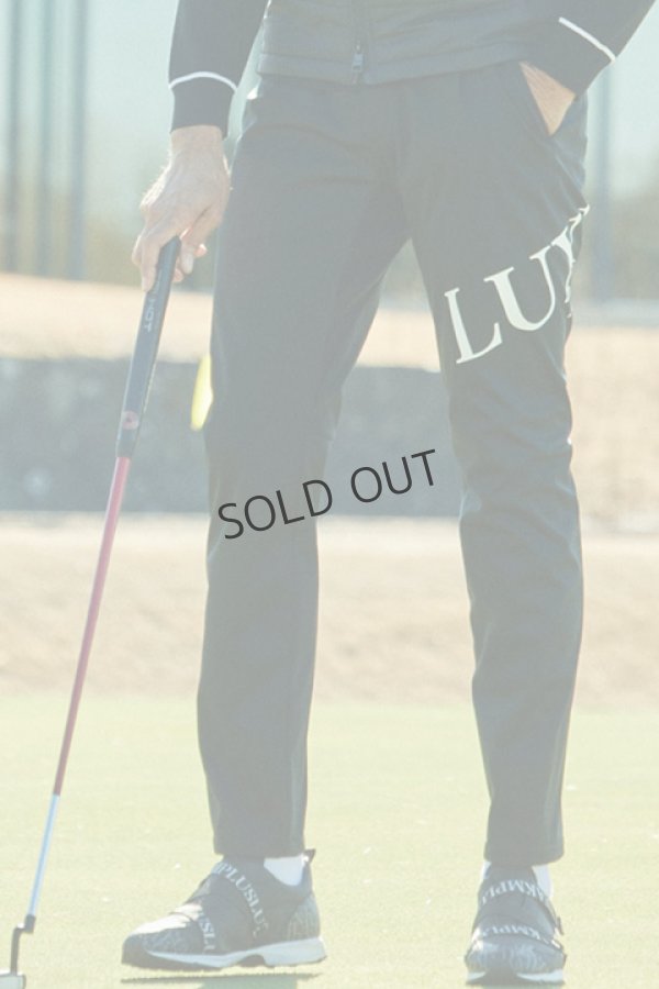 画像1: LUXEAKMPLUS リュクスエイケイエムプラス ゴルフ ビッグロゴ防風ロングパンツ{-BDA} (1)